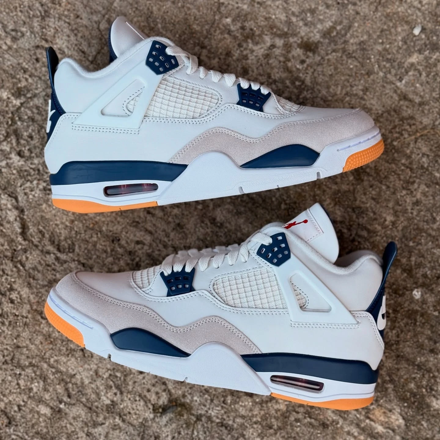 Air Jordan 4 Navy SB cement background